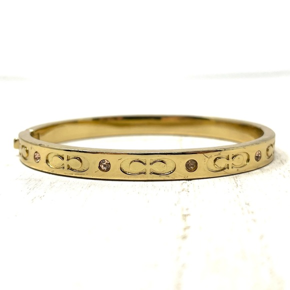 COACH logo gold tone hinged bangle bracelet